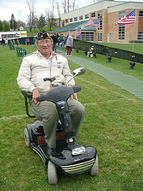 Vietnam veteran volunteer at Vietnam Veterans Memorial replica "The Wall That Heals" on tour at Ralph Sampson Park/Simms Education Center in Harrisonburg, Virginia